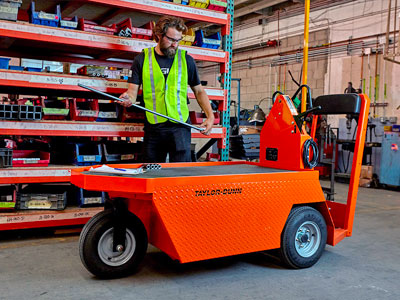 Taylor Dunn orange utility vehicle