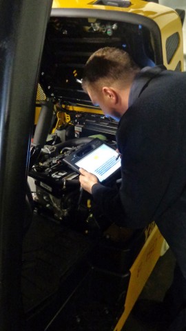 Barclay technician working on forklift