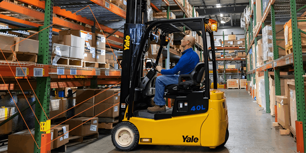 Man on a forklift in a warehouse